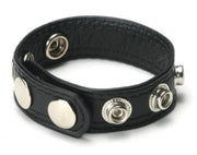 Black leather cock ring with silver snaps for adjustable fit.