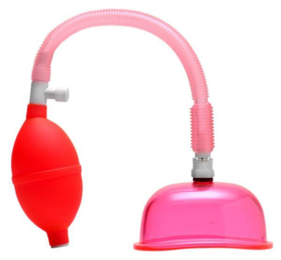 A pink hose connects a red bulb pump to a clear pink suction cup.