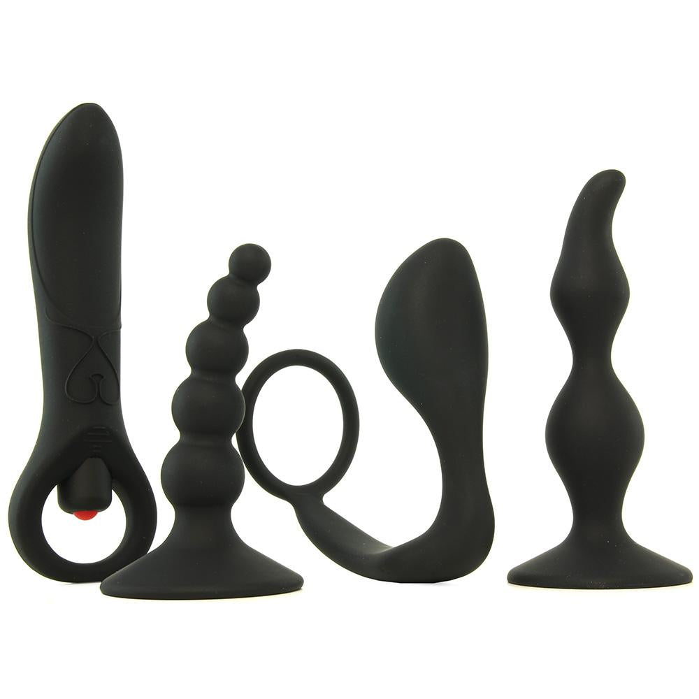 Four black silicone adult toys including a vibrator, beaded plug, curved plug, and tapered plug.