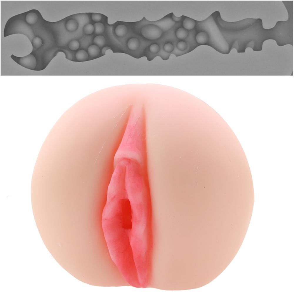 Pink realistic vaginal stroker with beaded interior channel.