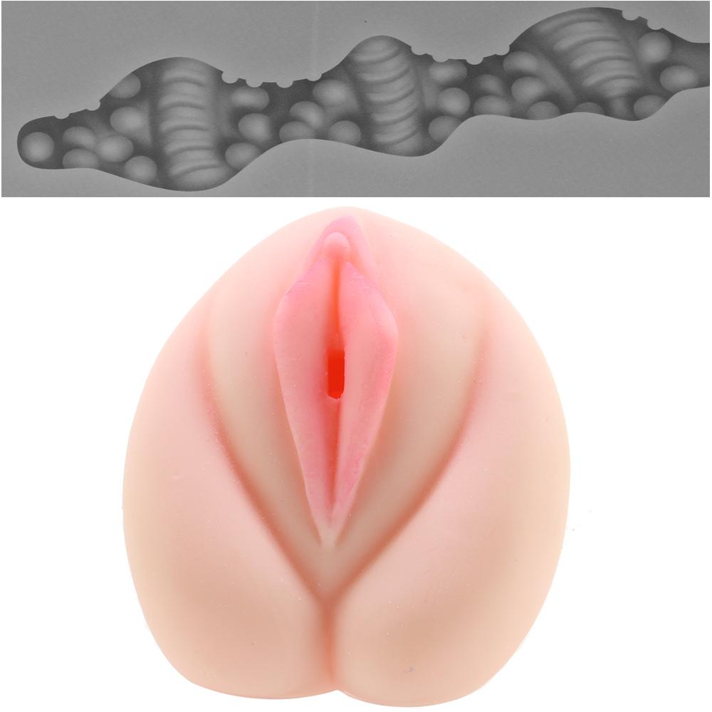 Realistic pink TPE vagina stroker with textured internal channel.