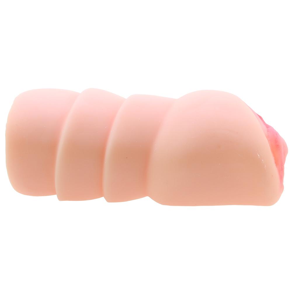 A pink textured vaginal stroker with ribbed channels.