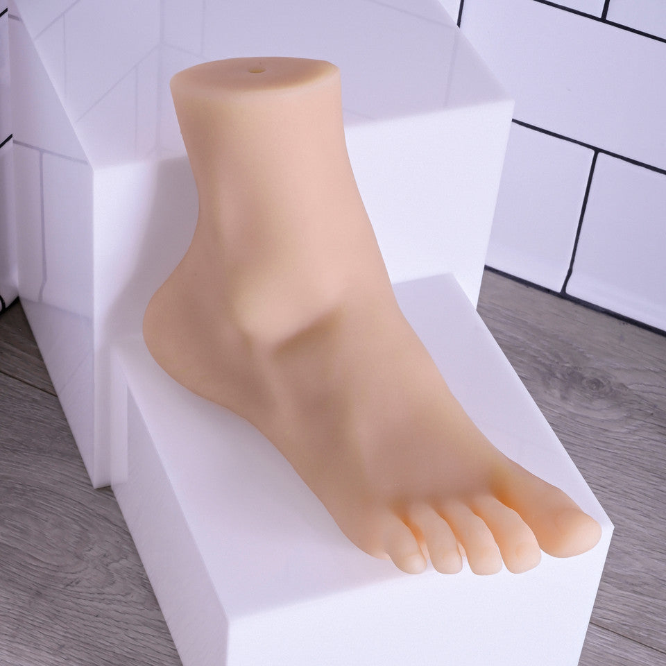 Realistic TPE foot model with detailed toes and arch.