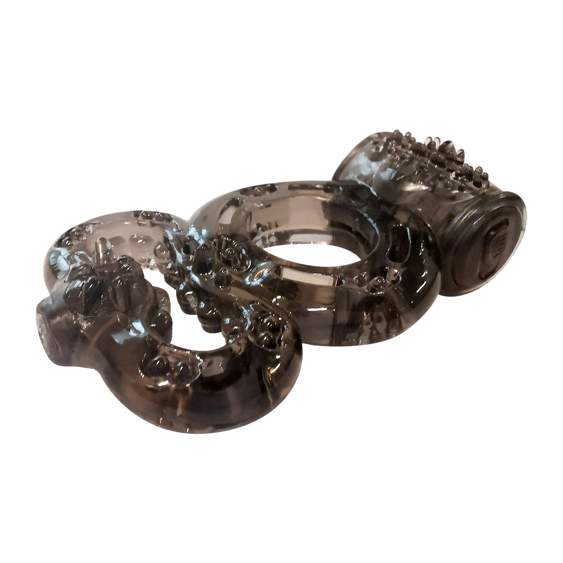 A black, textured, ring-like sex toy with multiple loops.