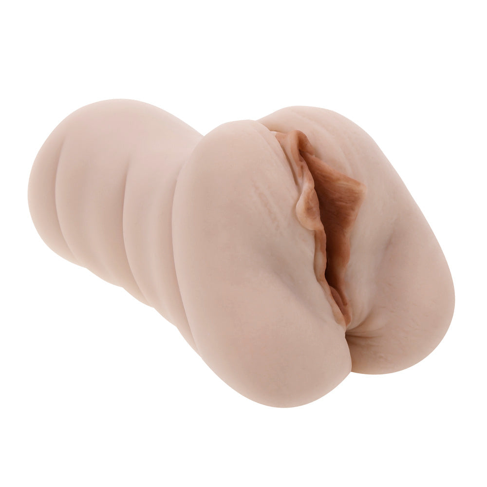 A pink dual-entry stroker toy with vaginal and anal openings, shown outside its waterproof canister.