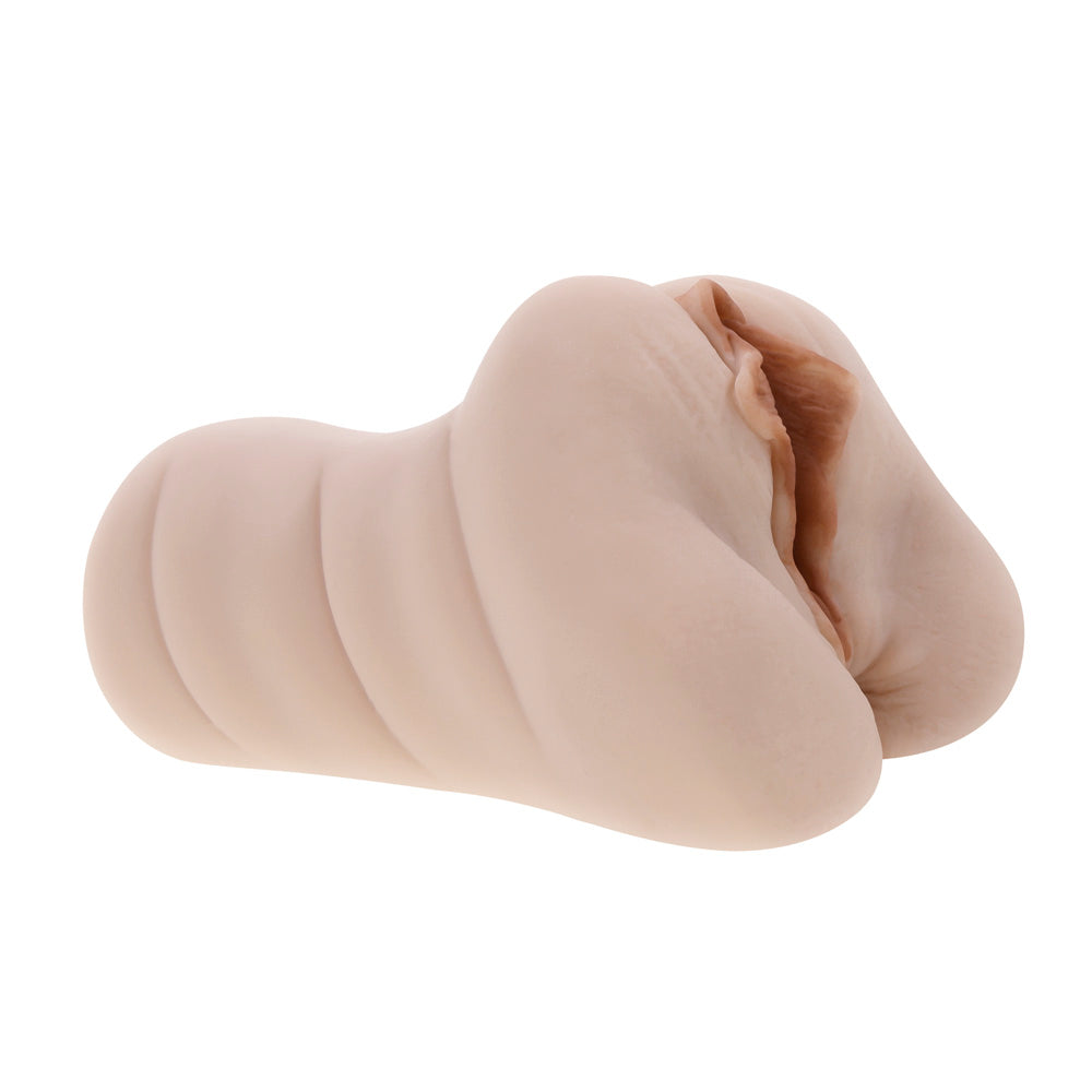 Dani Daniels dual entry stroker in beige TPR with vaginal and anal openings.