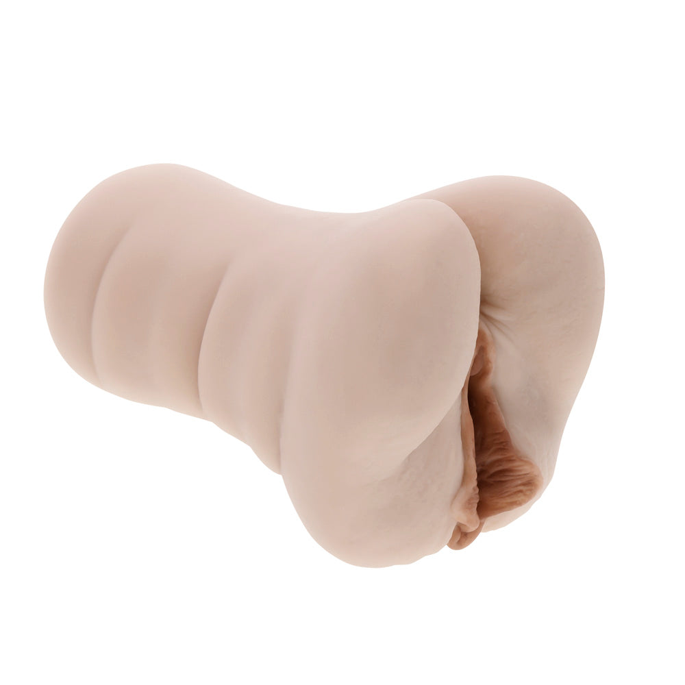 A realistic flesh-toned dual entry stroker with a textured exterior.