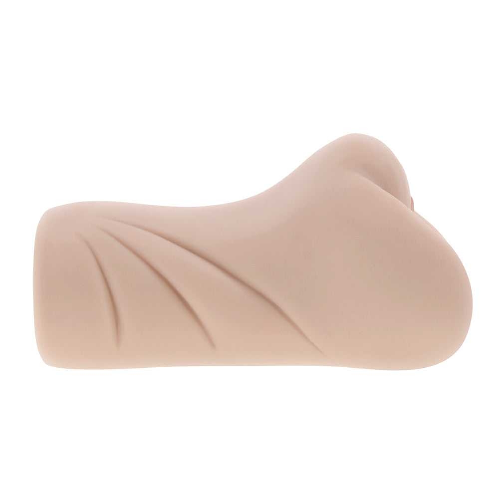 A beige dual-entry stroker with textured grooves.