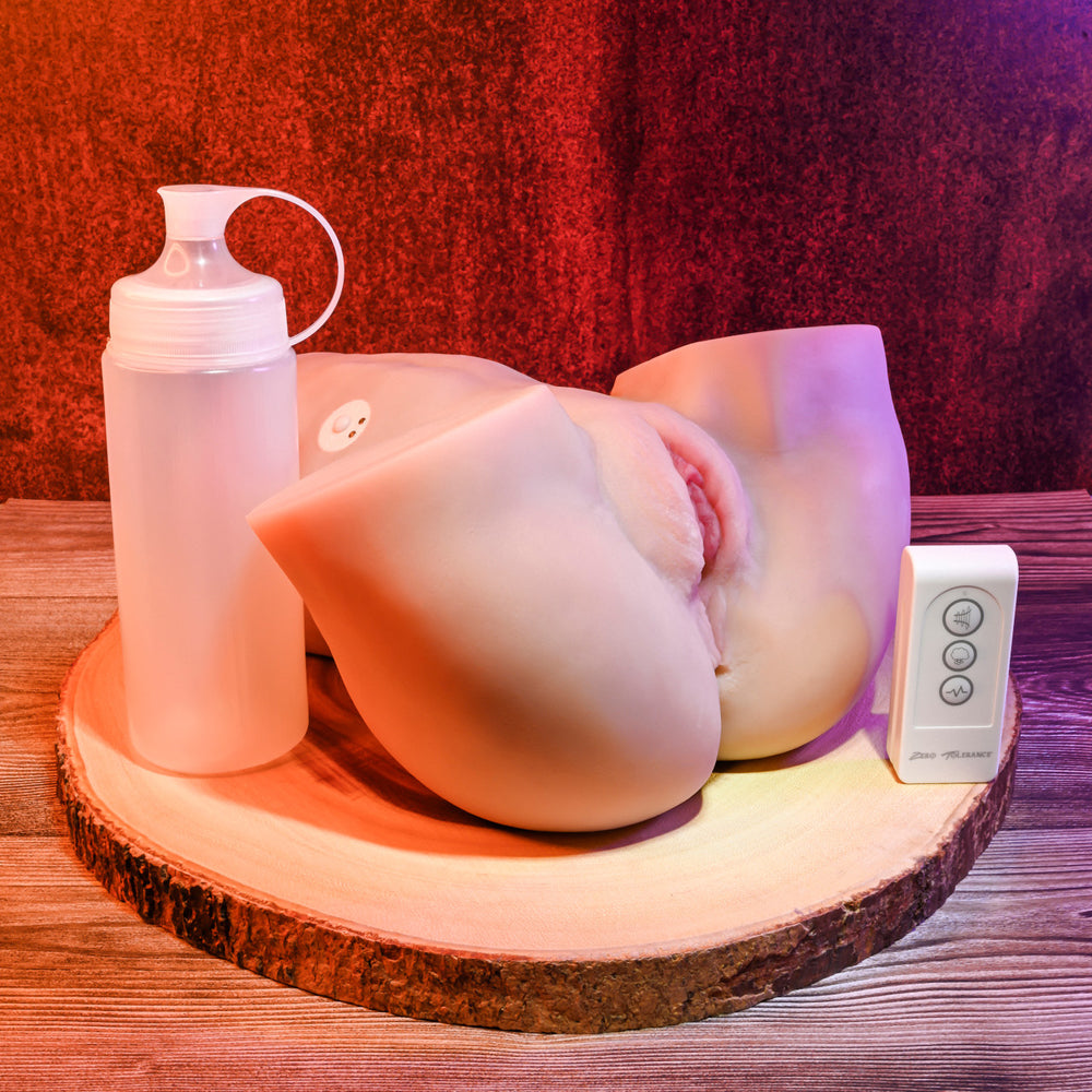 Dual motor sucking stroker with remote control and lube bottle.