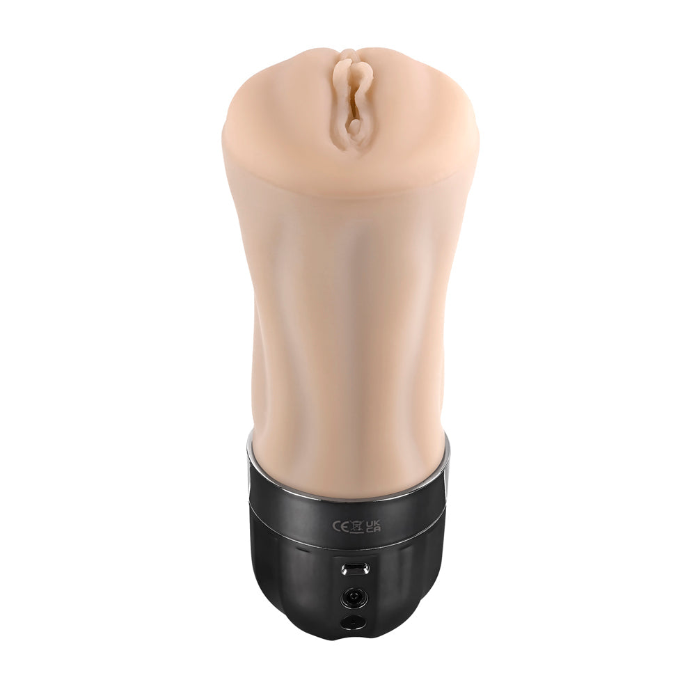 A flesh-toned vibrating stroker with a black base and charging port.
