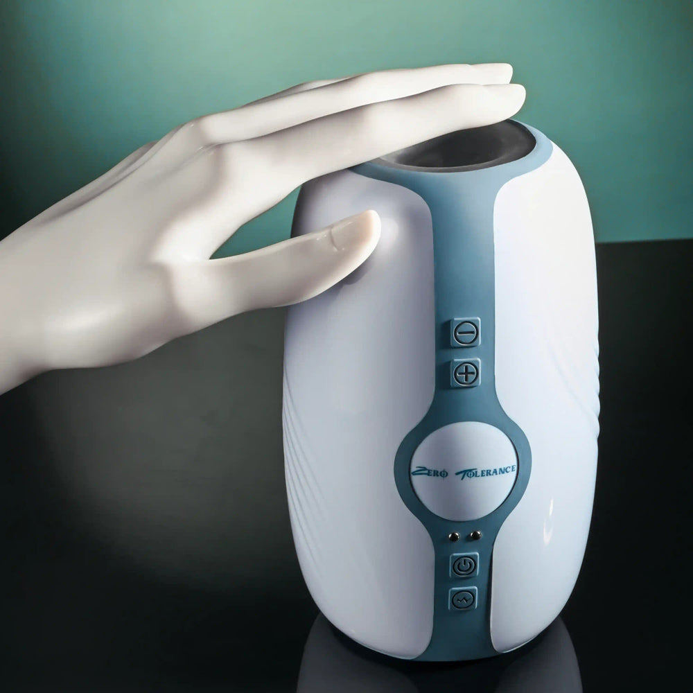 A white and blue stroker with a hand touching its top.