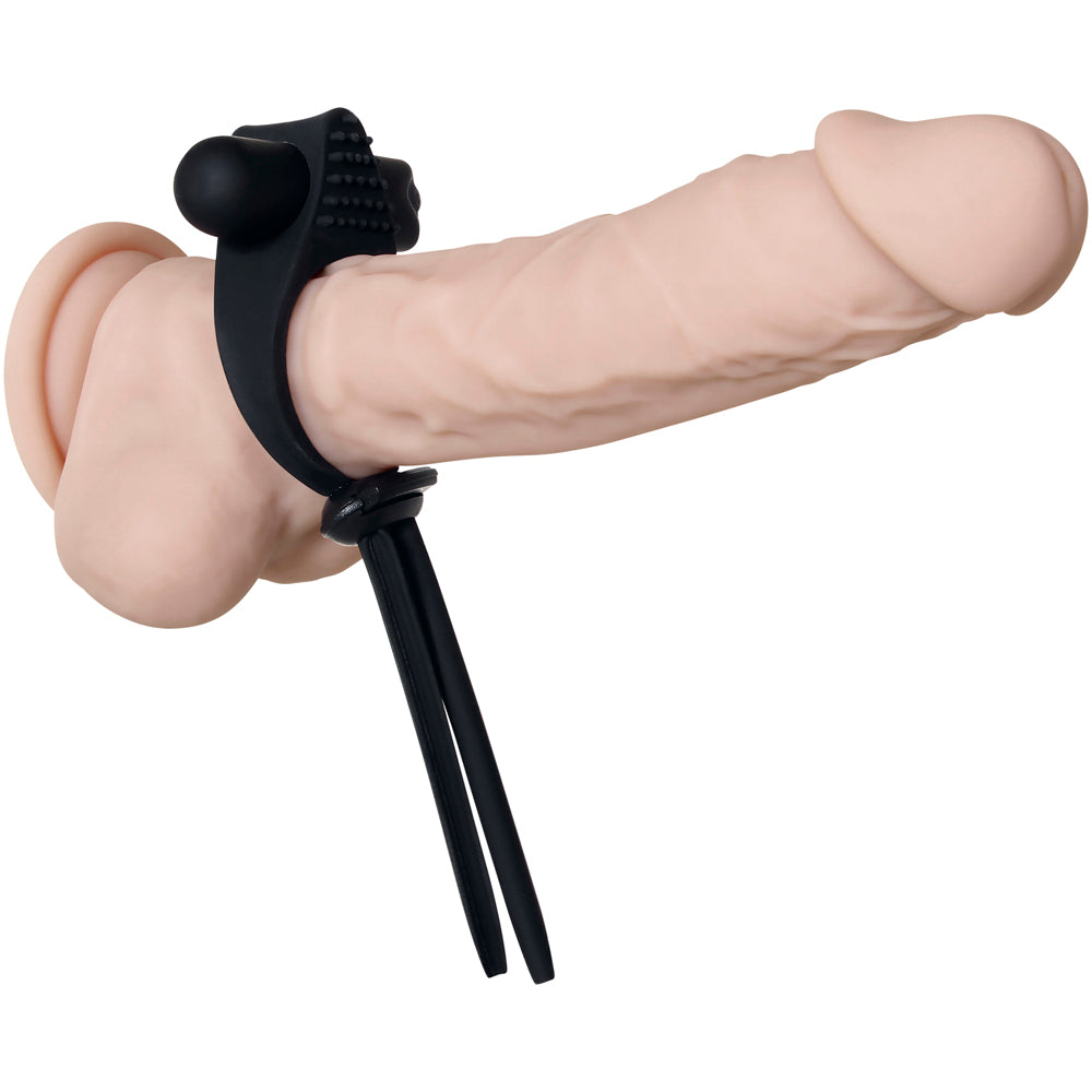 Adjustable vibrating cock ring with textured nub and straps, made of silicone.