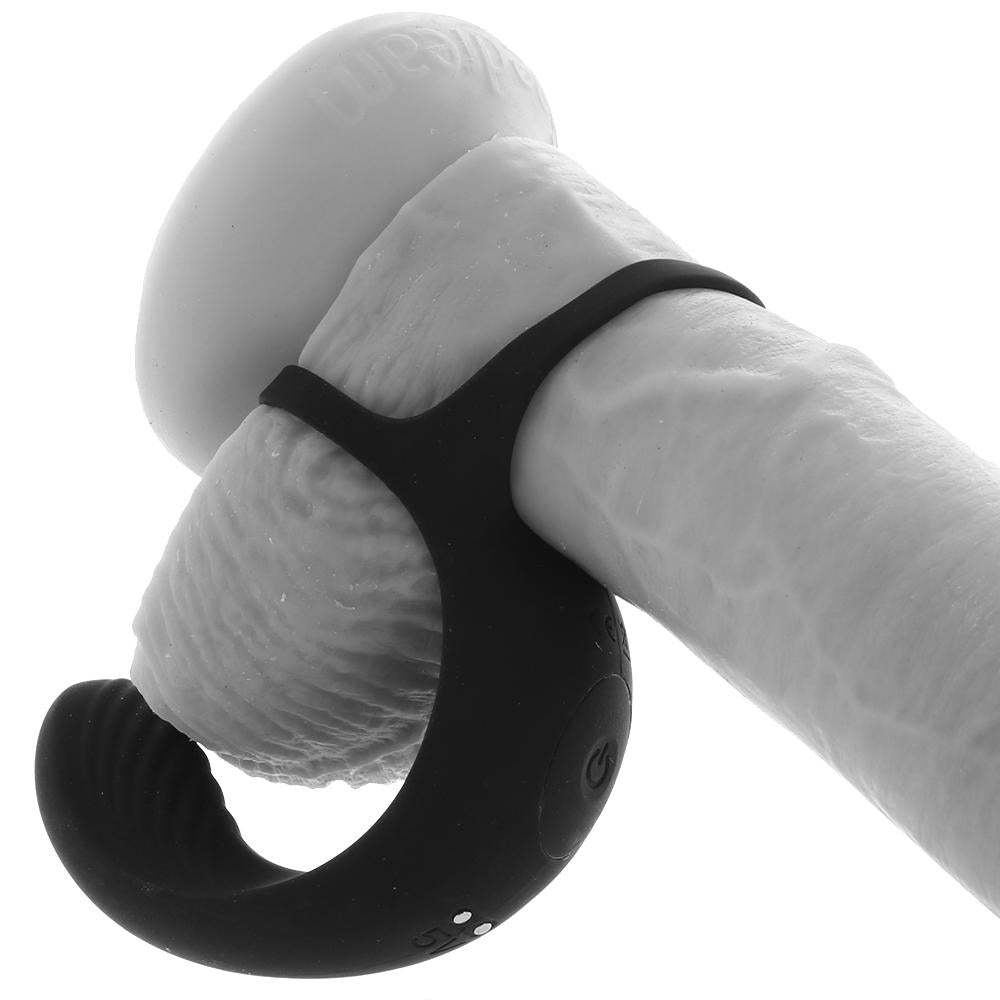 Black vibrating cock ring with a textured base and a cradle for the scrotum.