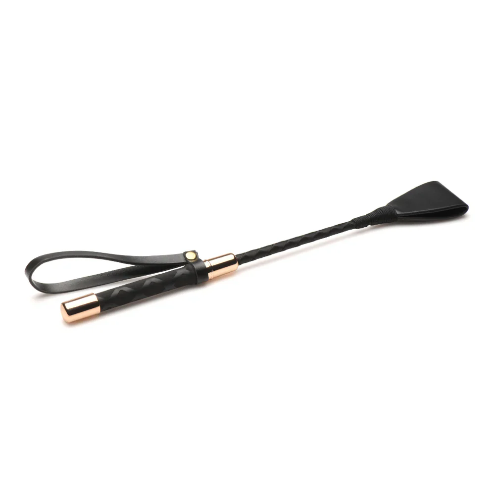 Black vegan leather riding crop with a textured grip and gold accents.