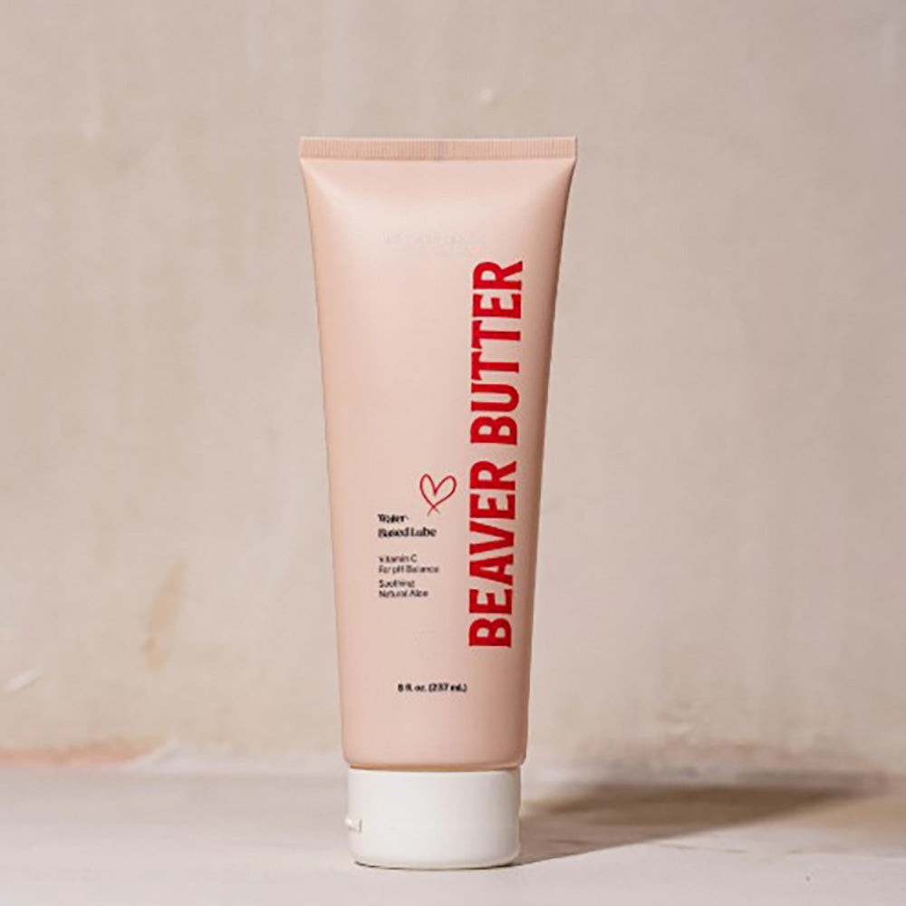 A pink tube of Beaver Butter water-based lube with red text.