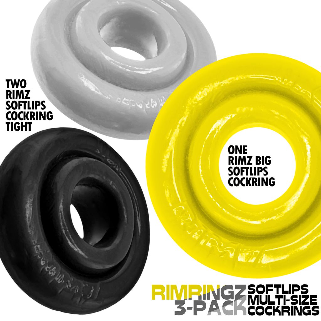 Three silicone cock rings in black, white, and yellow.