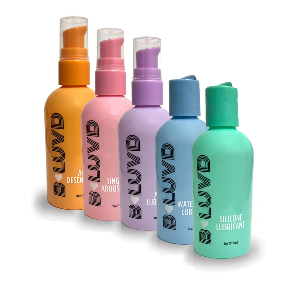 Five bottles of B-Luvd lubricant in orange, pink, purple, blue, and green.