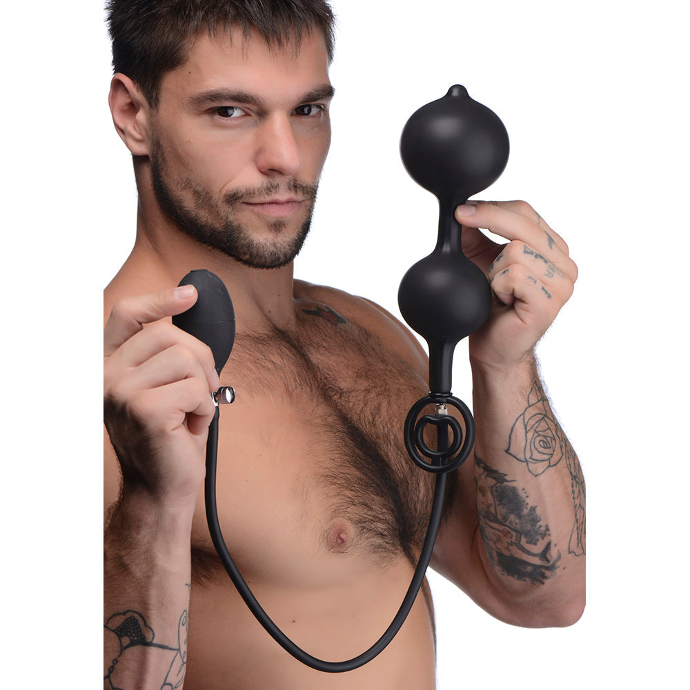 Inflatable silicone anal plug with cock ring.