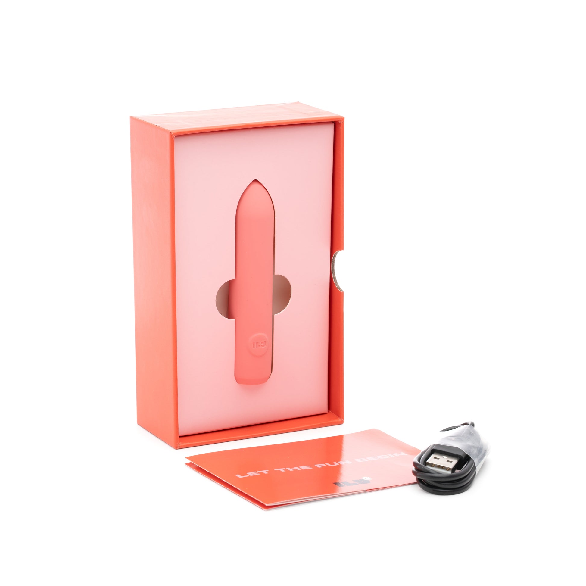 A pink bullet vibrator in its box with a USB cable and manual.