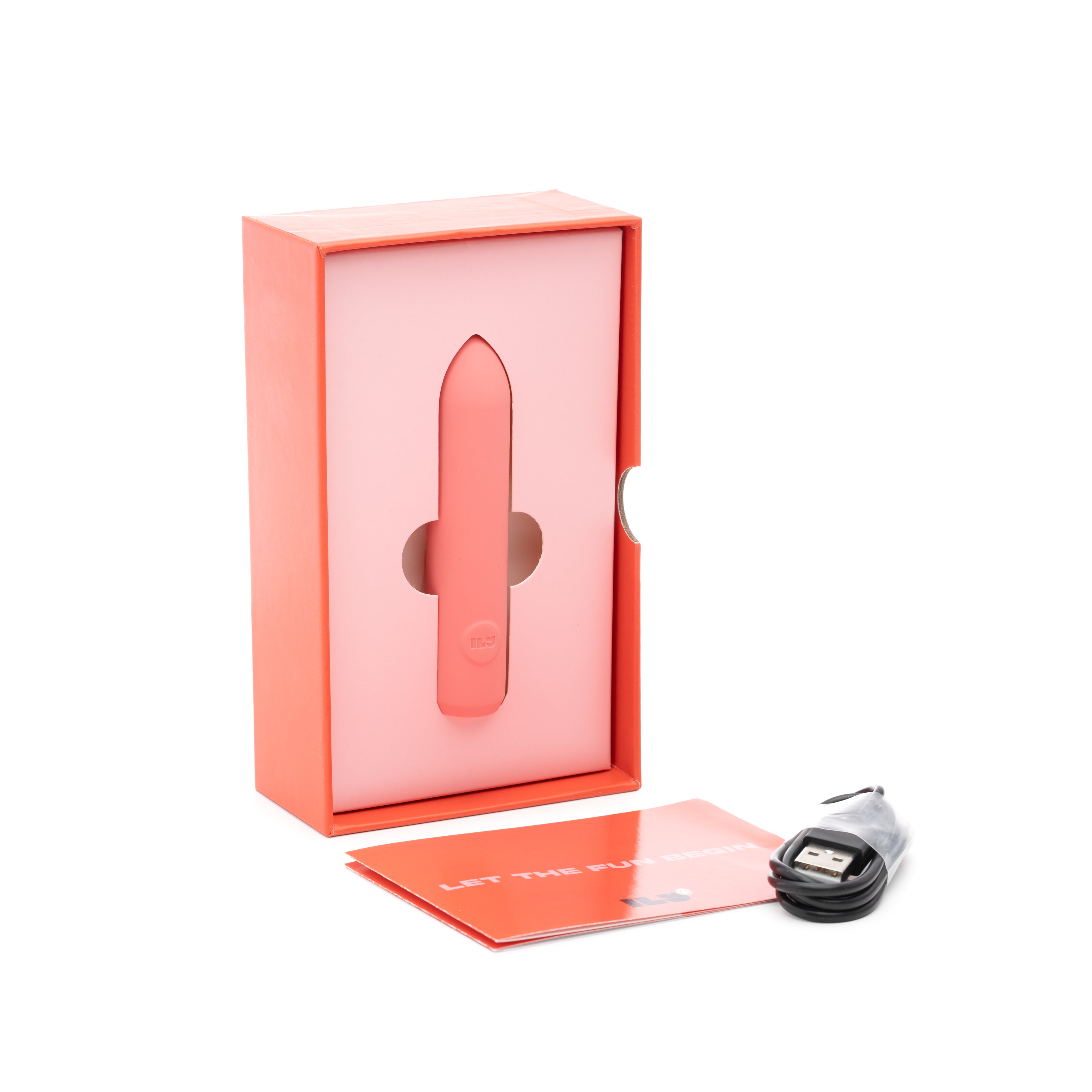 A pink bullet vibrator in its box with a USB cable and manual.