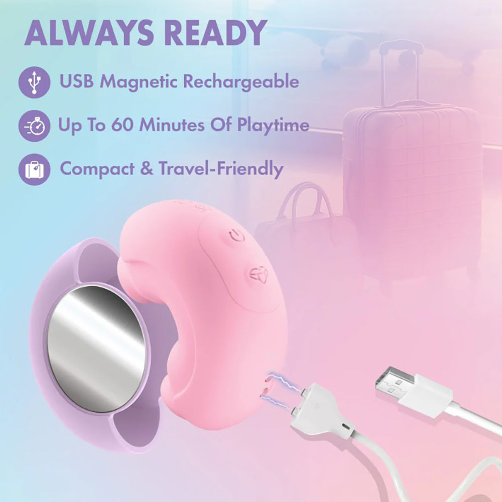 Pink dual-ended vibrator with USB charging cable and travel accessories.