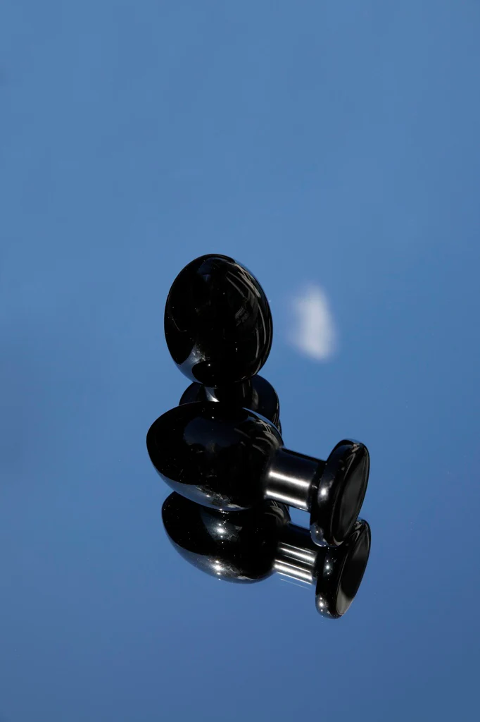 Black obsidian anal wand with a smooth, polished finish.