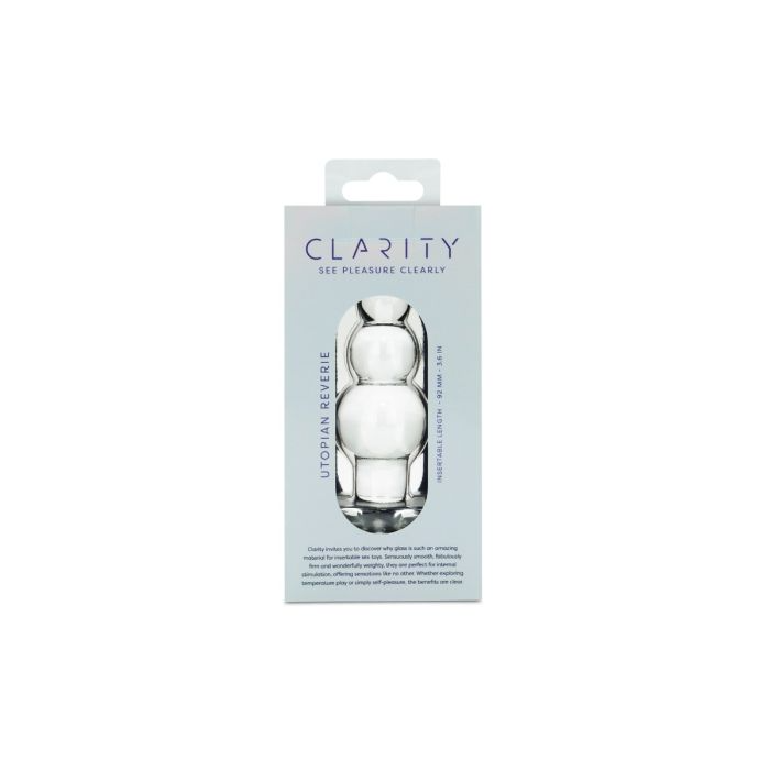 A clear glass anal bead toy with a rounded shape and text indicating "CLARITY" and "UTOPAIN REVERIE".