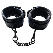 Black padded leather wrist cuffs with a connecting chain and lockable buckles.