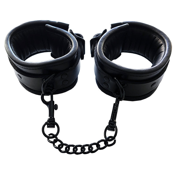 Black padded leather wrist cuffs with a connecting chain and lockable buckles.