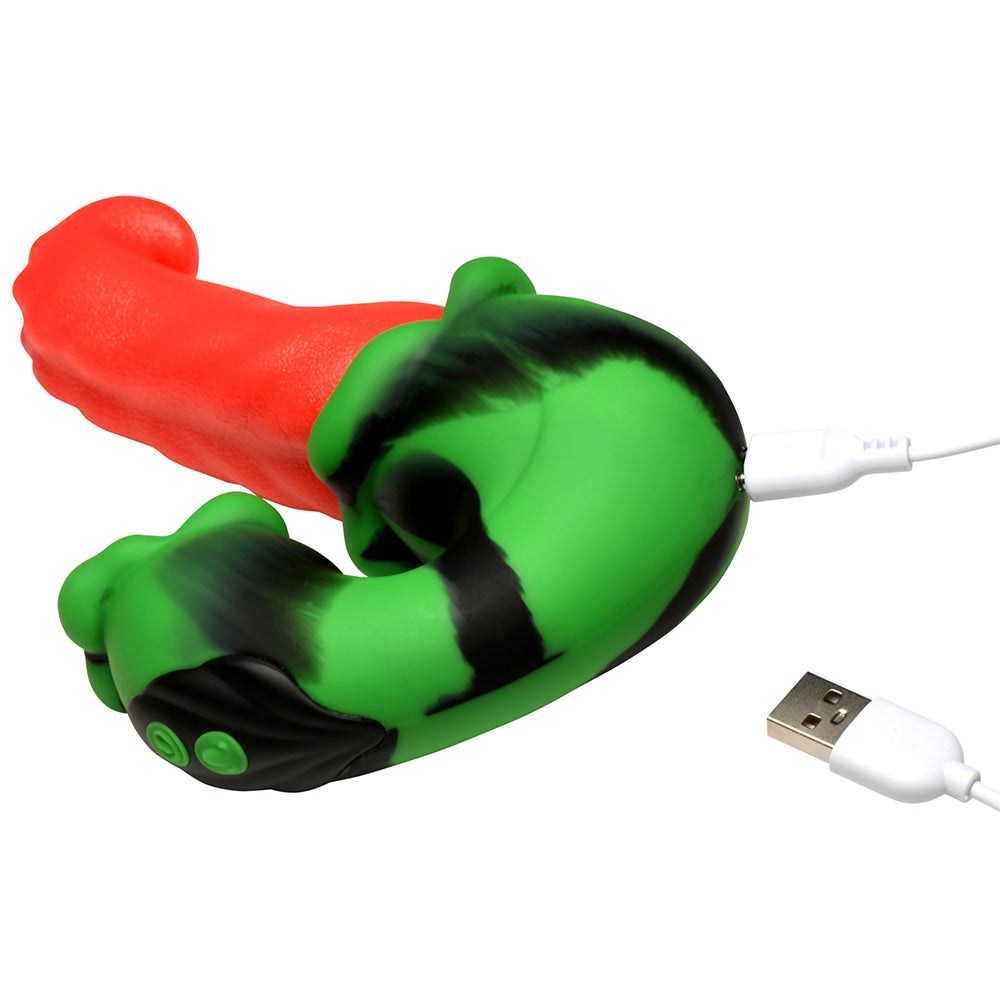 A green and black striped silicone vibrator with a red tongue attachment, connected to a USB cable.