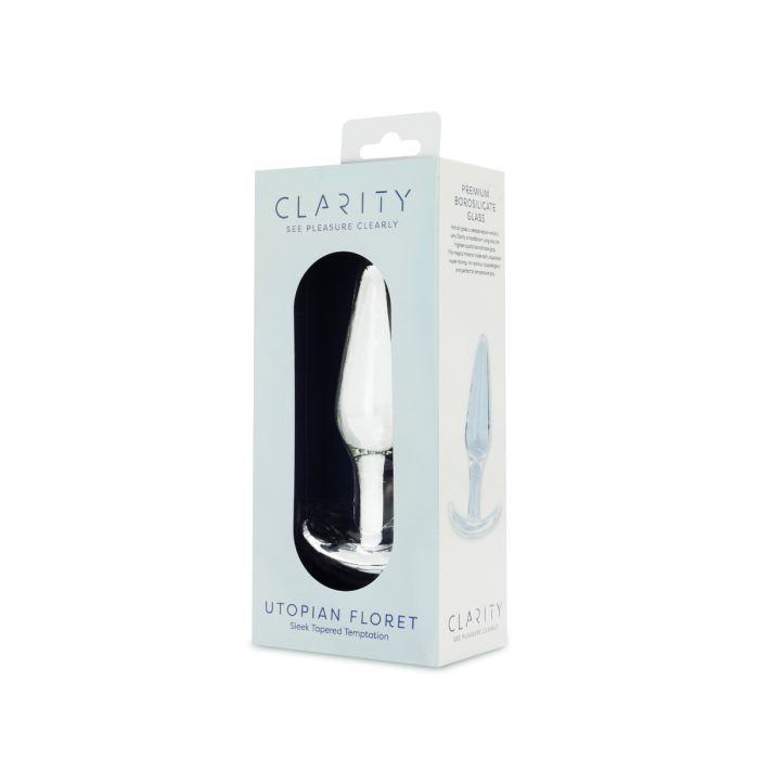 A clear glass anal plug with a tapered shape and a flared base, presented in its packaging.