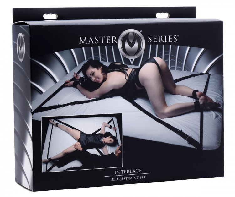 Master Series Interlace bed restraint set with cuffs on a bed.
