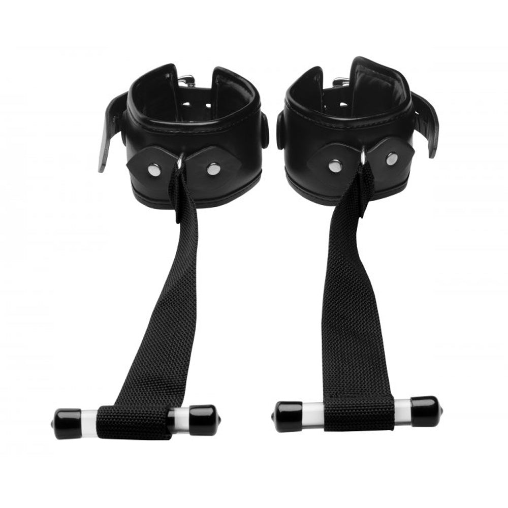 Black padded cuffs with straps and handles for over the door use.
