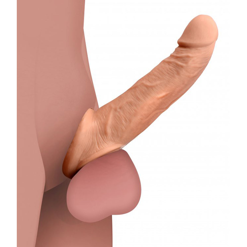 Realistic penis extension sleeve with solid tip and scrotum strap.