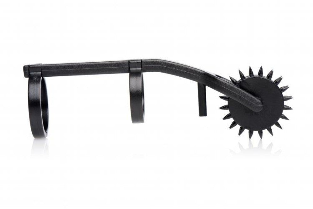 Black double finger pinwheel sensation toy with spiked wheels.