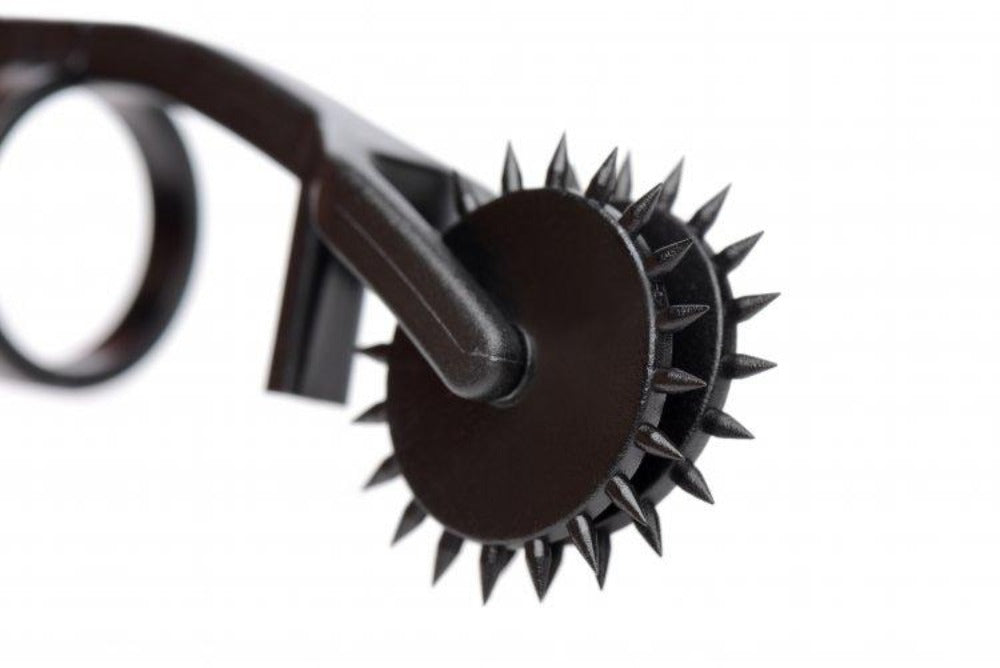 Black double finger pinwheel sensation toy with spikes.