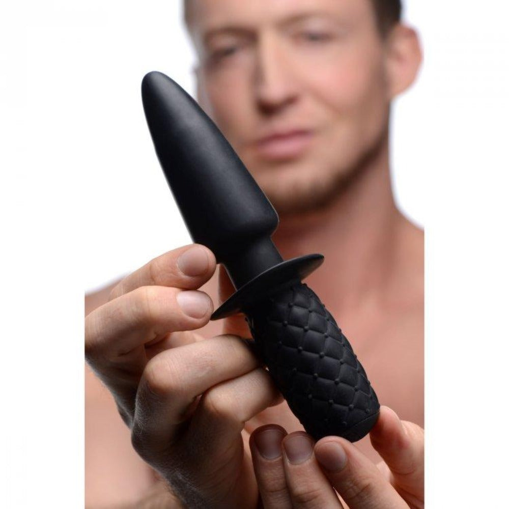 Black silicone anal thruster with textured handle and tapered tip.
