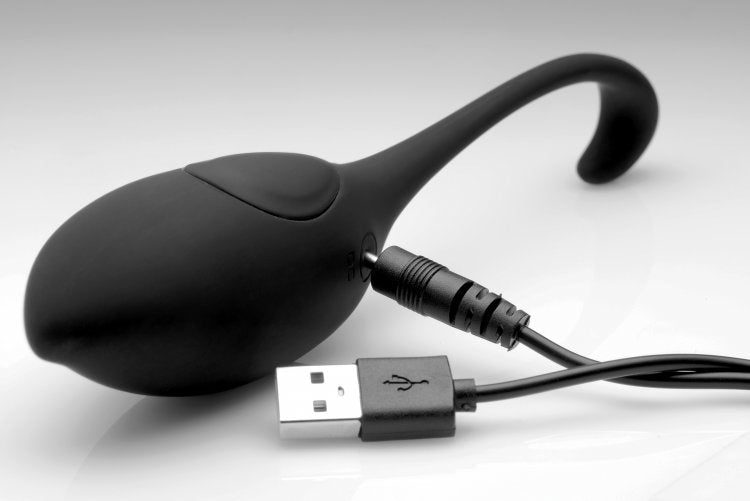 Black silicone vibrating egg with a USB charging cable attached.
