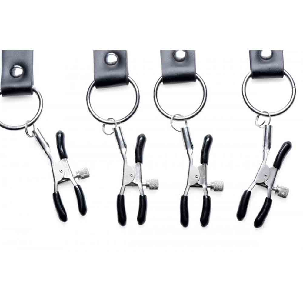 Four black labia spreader straps with adjustable clamps.