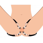 Black labia spreader straps with adjustable clamps.