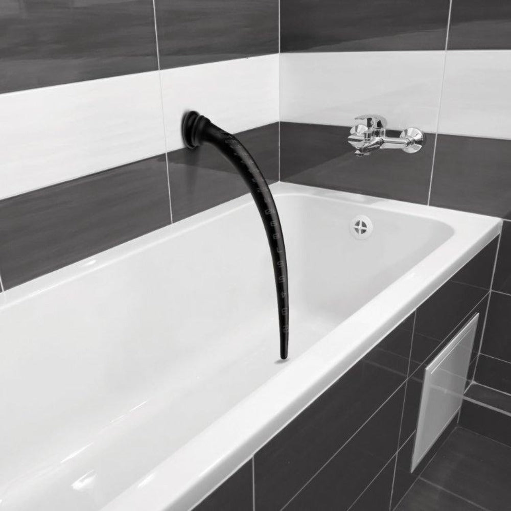 Black silicone anal hose with suction cup and inch markers.
