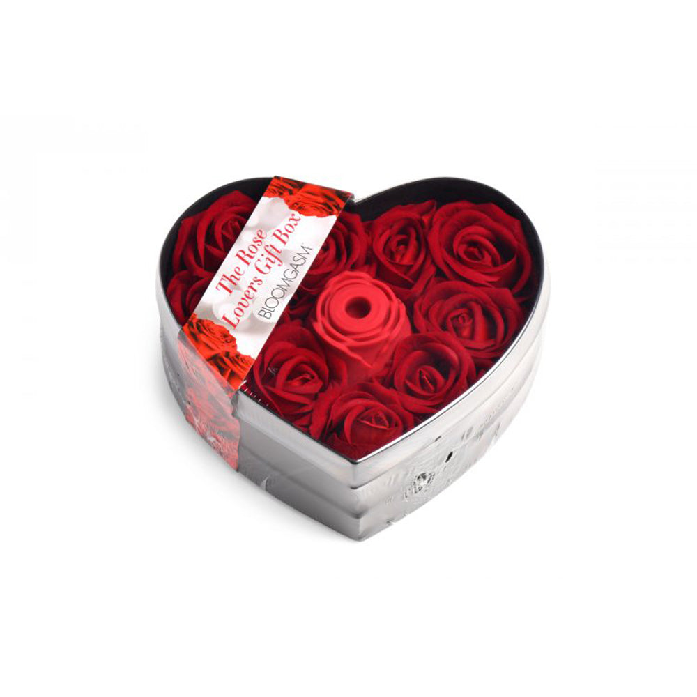 Heart-shaped gift box with faux red roses and a red silicone rose toy.