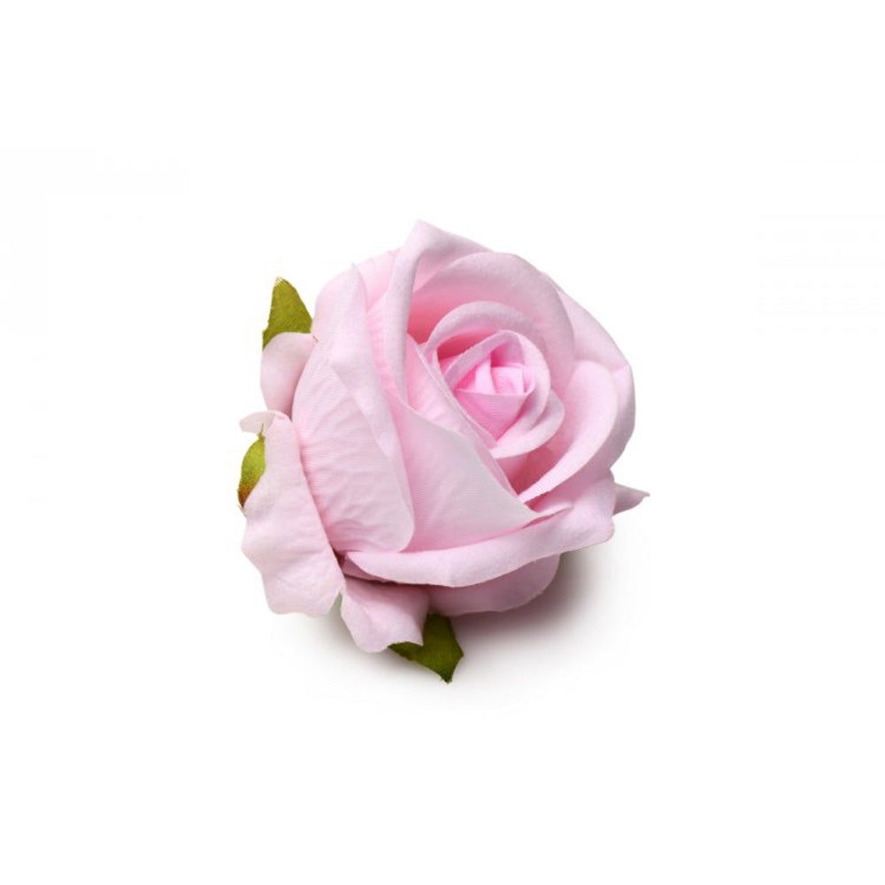 Pink silicone rose toy with faux roses in a gift box.