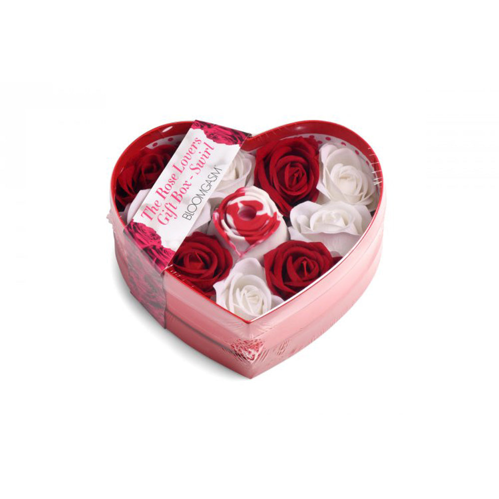 Heart-shaped gift box with red and white faux roses and a rose toy.