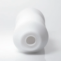 A white, textured male masturbator with an opening at the bottom.