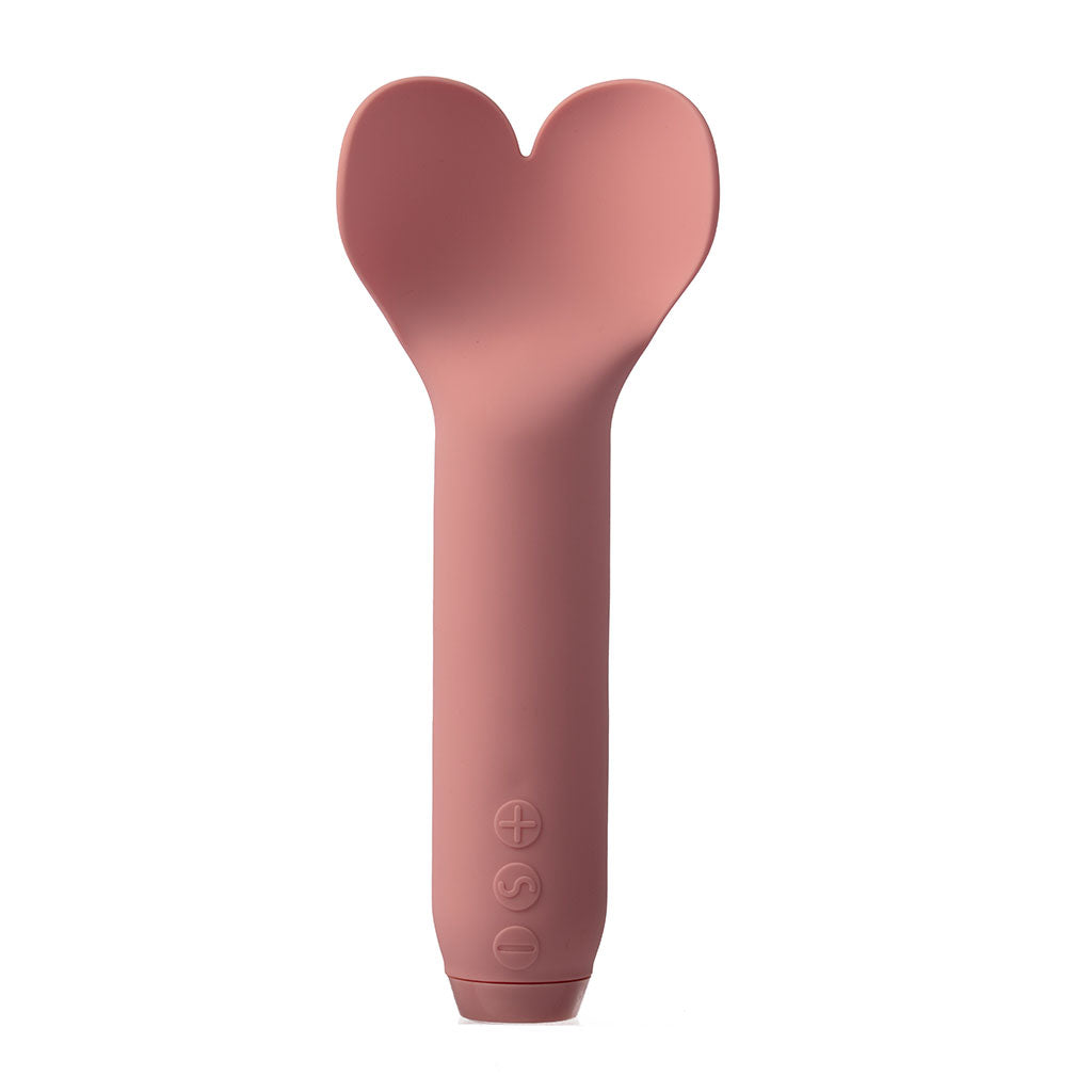 A pink heart-shaped silicone vibrator with control buttons.