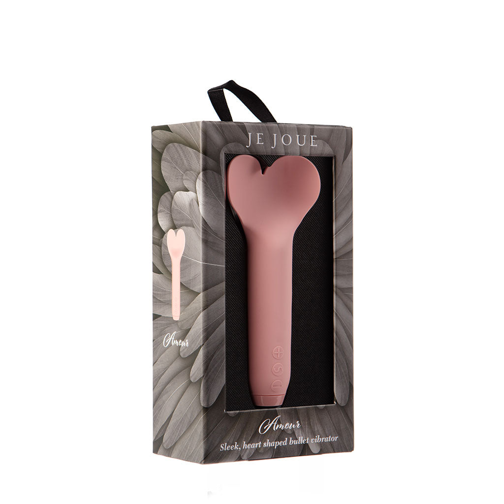 Pink heart-shaped bullet vibrator in its packaging.