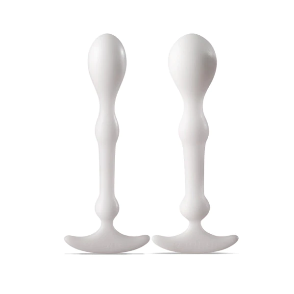 Two white anal swizzle sticks with flared bases and bulbous tips.