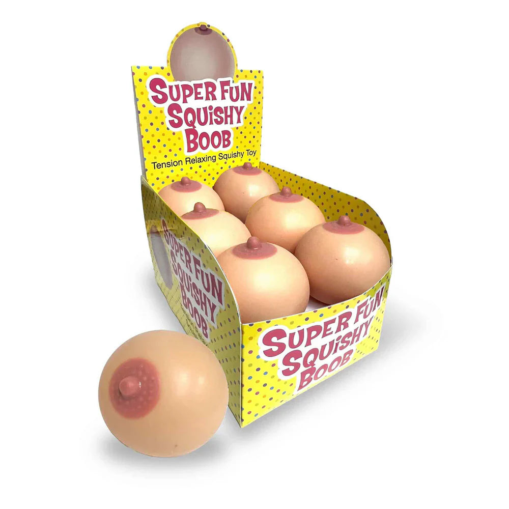A box of six squishy toys shaped like breasts, with one toy in front of the box.