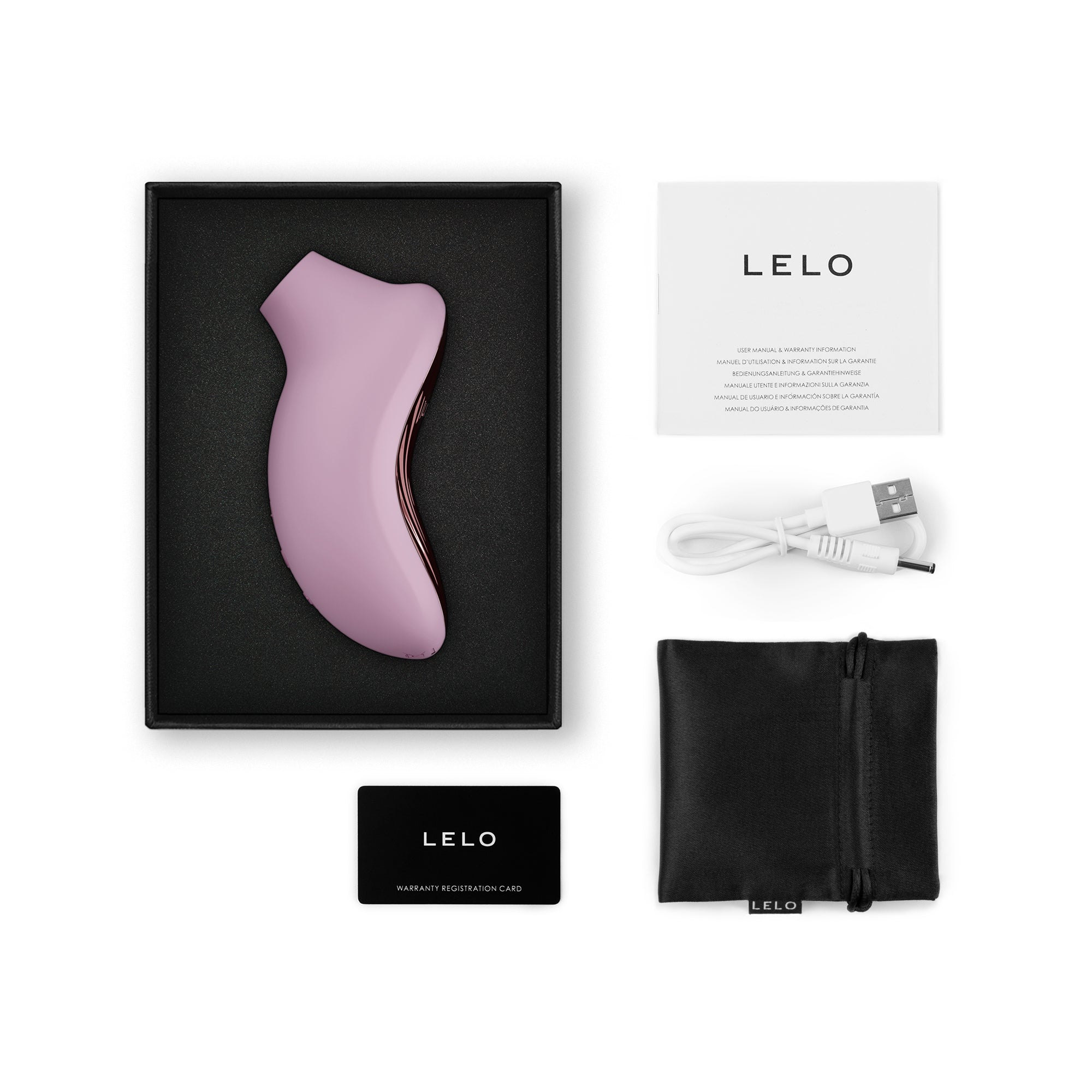 App-controlled pink silicone clitoral stimulator with charging cable and manuals.